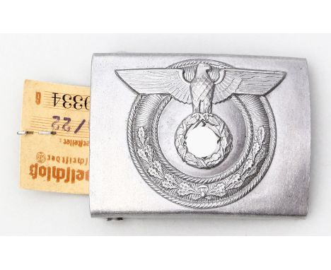 Koppelschloss für SA-Wehrmanschaften. Aluminium. Ende 30er/Anf. 40er Jahre. 5x 6,5 cm. Ungtragen mit originalem Herstellereti