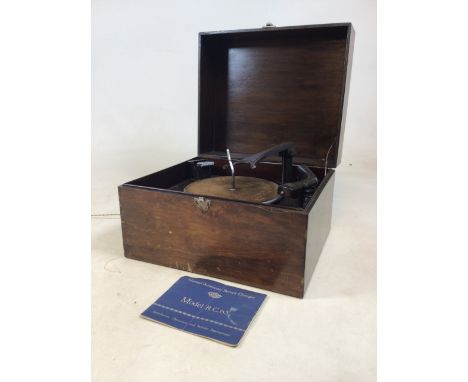 A Garrard automatic record changer. Model R.C.65 with manual. W:43cm x D:36cm x H:29cm