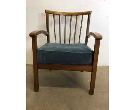 A mid century stick back hardwood arm chair. W:53cm x D:60cm x H:71cm