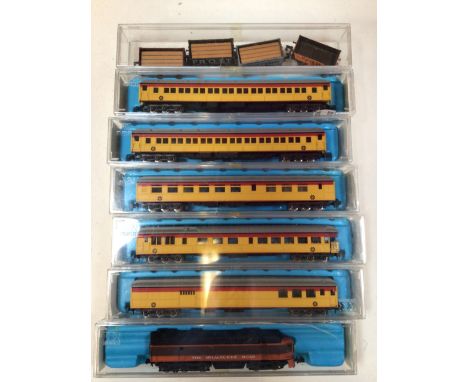 Rivarossi N gauge. The Milwaukee Road engine also with five passenger carriages and four freight wagons by Graham Farish. 
