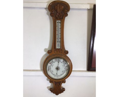 An oak barometer. H:90cm