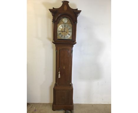 A George III mahogany long case clock with arched dial gilt spandrels, silver chapter ring named to arch Henry Cooley London.