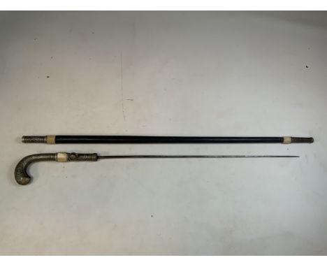 An Anglo Indian sword stick or pig sticker with bone separators and chased white metal handle. Square 55cm blade. H:98cm