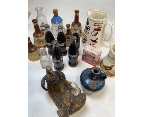 A collection empty Bells Old Scotch Whisky decanters with glass Bells decanter. Together with five Coca-Cola glass bottles an