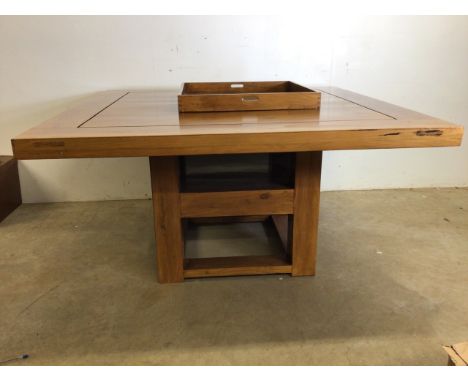 A square hardwood table by Margaret Muir with centre tray and shelf underneath also with two hidden drawers. W:152cm x D:152c