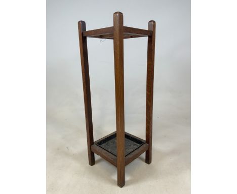 An oak stick stand with metal drip tray.W:26cm x D:26cm x H:77cm