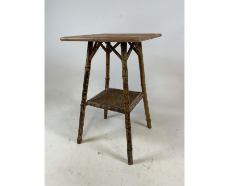 A bamboo side table on four legs with single shelf. W:38cm x D:38cm x H:64cm