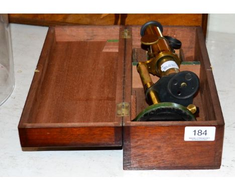 A cased microscope containing glass slides 