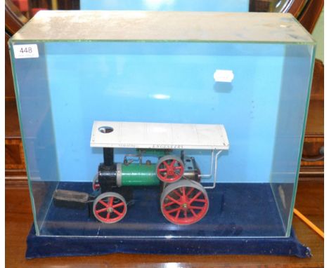 Mamod steam engine in a glazed table top display case 