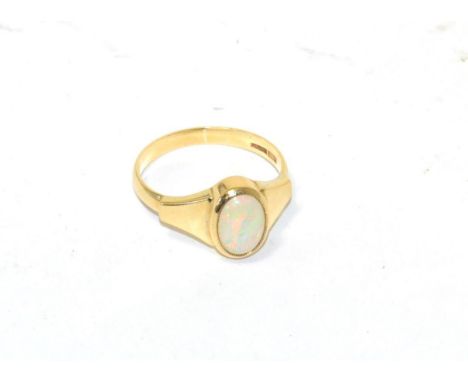 A 9ct gold and opal set dress ring 