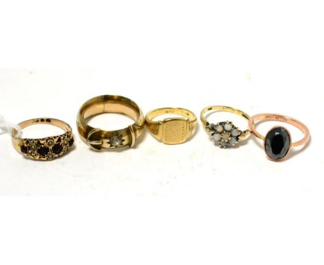 An amethyst and seed pearl ring, an opal cluster ring, a signet ring and a paste set buckle ring (5) 