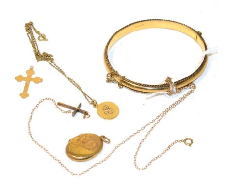 A 9ct gold hinge opening bangle, a 9ct gold cross pendant on chain, another cross pendant, a 9ct gold pendant on chain and a 