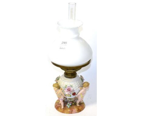 Continental porcelain figural oil lamp with opaque shade