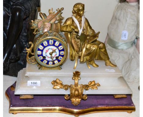 A gilt metal and alabaster striking mantel clock, circa 1900, raised upon a gilt wooden base 