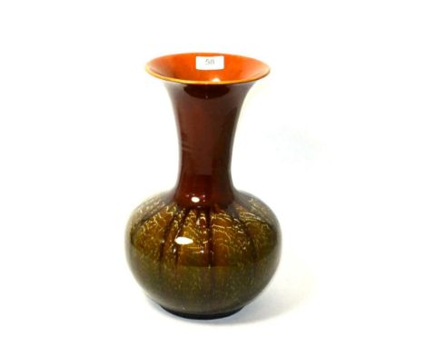 A Linthorpe pottery flared bottle vase 33cm high, crazed throughout and with a hairline crack at the base of the neck going h