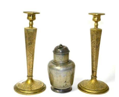 A Chinese pewter plum wine flask, Qing, 16cm high; and a pair of brass candlesticks with engraved decoration, 26cm high (3)