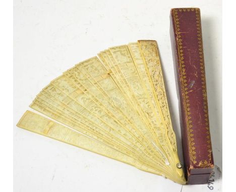 A Cantonese ivory brisee fan, circa 1856, carved and pierced with figures and dragons, 19cm long, in gilt red morocco case fo