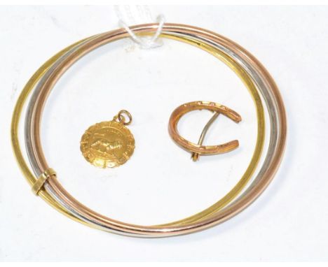 A three colour bangle stamped '375', a horseshoe brooch and a charm (3) 