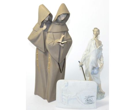 A Lladro group of two monks, a Lladro plaque and a Nao figure 