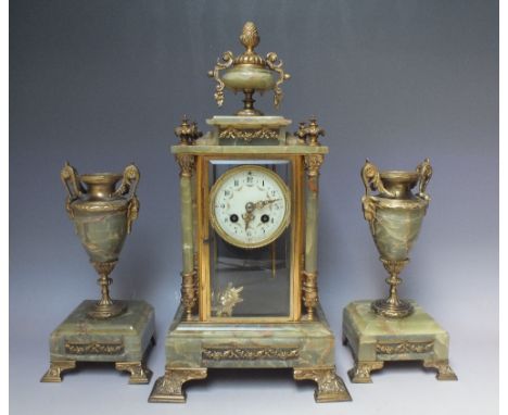 A GREEN ONYX  AND GILT METAL FRENCH CLOCK GARNITURE, the four glass clock case with pilasters and urn surmount, the 8 day mov