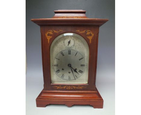 AN EARLY 20TH CENTURY GUSTAV BECKER INLAID MAHOGANY BRACKET CLOCK, the architectural case with glazed side panels, arched dia