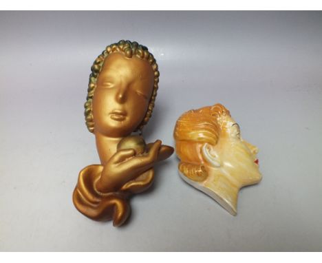 AN 1940S CERAMIC WALL MASK, H 13 cm, together with an Art Deco plaster wall mask in the style of Goldscheider's 'Eva', H 20.5