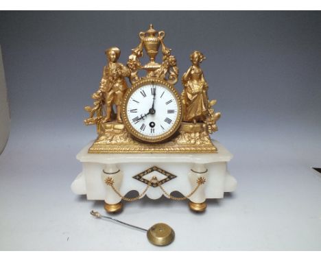 A FRENCH GILT METAL AND WHITE ALABASTER DECORATIVE MANTLE CLOCK, the circular enamel dial with Roman numerals and outer minut