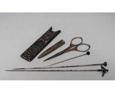 A CHARLES HORNER SILVER HAT PIN, stamped 925 and CH, together with two further hat pins, a hallmarked silver comb case and a 
