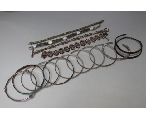 A COLLECTION OF MOSTLY SILVER BRACELETS AND BANGLES, to include a set of six 'Milor' 925 bangles, a Barry Kronen gemset bangl