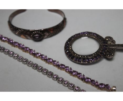 A COLLECTION OF SILVER AND AMETHYST JEWELLERY, comprising an unusual pendant eyeglass stamped 925 suspended on a silver chain