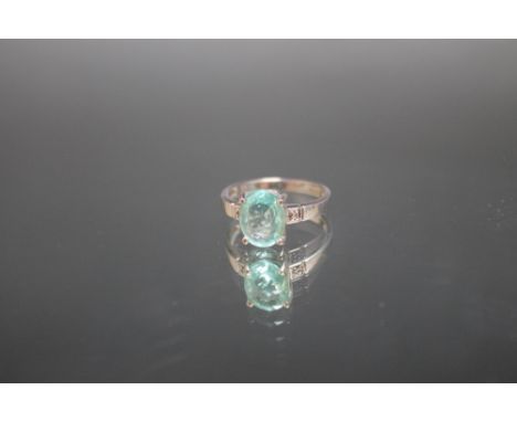 A HALLMARKED 18 CARAT WHITE GOLD GEM SET RING, set with a light green oval stone, ring size N