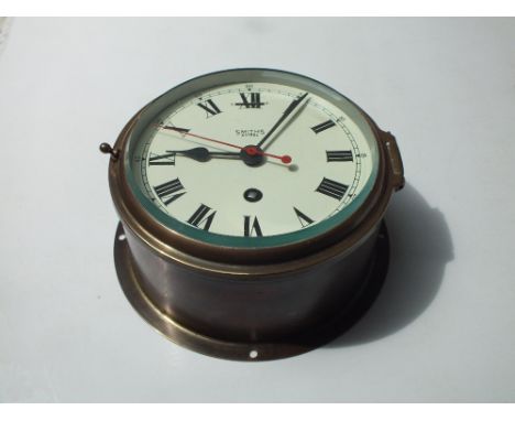 SMITHS 'ASTRAL' BRASS CASED BULKHEAD CLOCK, the circular dial with Roman numerals, Dia. 17.5 cm 