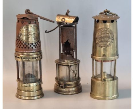 Group of three miner's safety lamp to include an unused Protector Lamp and Lighting co. ltd, a used Leeds made vintage miner'