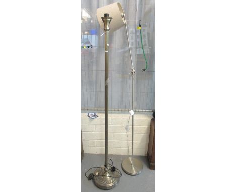 Modern silver finish angle poise standard lamp with shade, together with another brass finish standard lamp. Both on circular