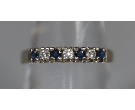 18ct white gold sapphire and diamond half eternity ring.  Ring size O.  Approx weight 2.2 grams.(B.P. 21% + VAT) 