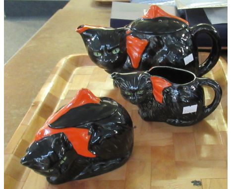 Three piece Crown Ducal ware black cat moulded three piece teaset containing; teapot, sugar bowl and milk jug. (B.P. 21% + VA