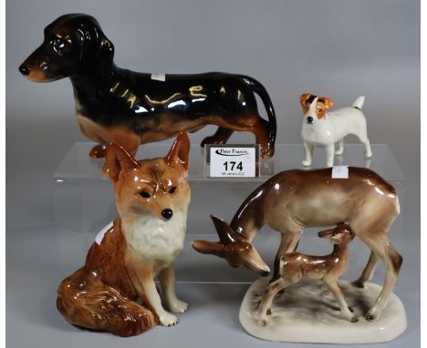 Collection of ceramic animals to include Beswick Dachshund, a seated fox, a Beswick hunting Jack Russel, and a continental fi