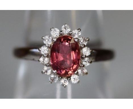 9ct white gold pink stone and white sapphire ring.  Ring size N&1/2.  Approx weight 2.3 grams.(B.P. 21% + VAT) 