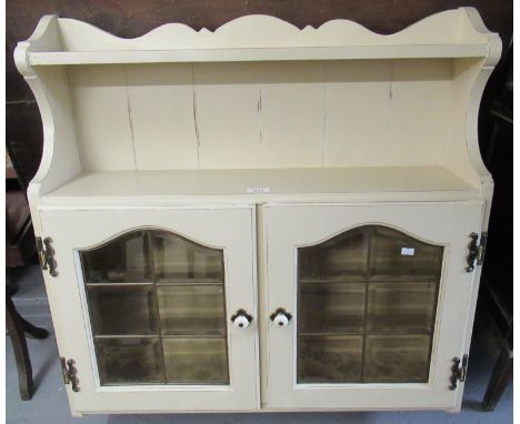 Modern painted kitchen wall cabinet, having two glazed doors and ceramic handles.(B.P. 21% + VAT) 