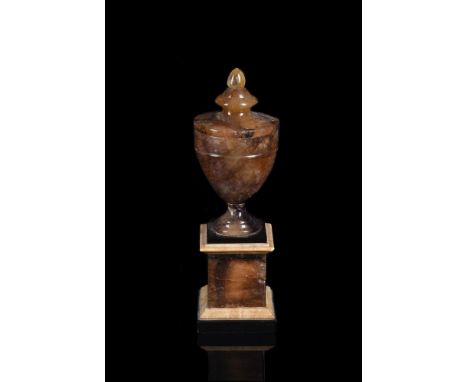 A BLUE JOHN PEDESTAL URN MID/EARLY 19TH CENTURY The turned tapering urn on black slate, white marble and blue john base34.5cm