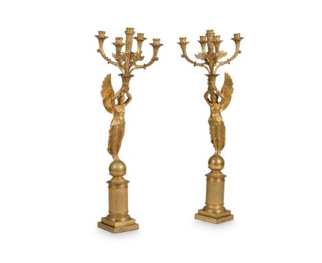 A PAIR OF LOUIS PHILIPPE FIVE-LIGHT GILT METAL CANDELABRAAFTER THE DESIGN BY PIERRE FONTAINE FOR THOMIRE, SECOND QUARTER 19TH