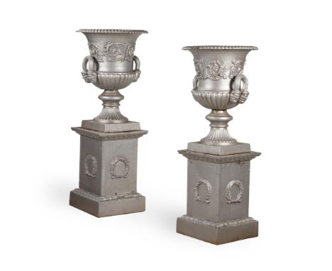 A PAIR OF HANDYSIDE PATTERN CAST IRON URNS AND PEDESTALS  LATE 19TH CENTURY Unmarked and with later silver decoration  Dimens