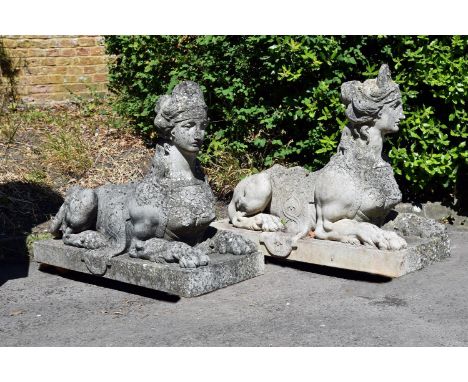 A PAIR OF COMPOSITION STONE SPHINXES  AFTER COADE, MODERN  One bearing Coade Lambeth signature to the plinth  each approximat