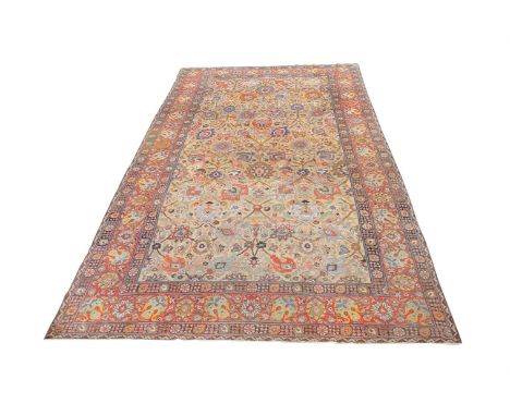 A LARGE TABRIZ CARPET With all over designapproximately 625 x 363cmCondition Report: Wear to carpet overall, resulting in var