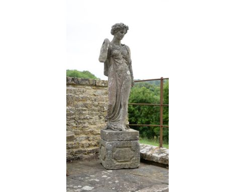 A STONE COMPOSITION MODEL OF A CLASSICAL MAIDEN ATTRIBUTED TO AUSTIN & SEELEY, MID 19TH CENTURY On an associated carved Cotsw