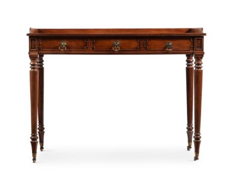 A REGENCY MAHOGANY DRESSING TABLEIN THE MANNER OF GILLOWS, EARLY 19TH CENTURYThe central of the three frieze drawers with int