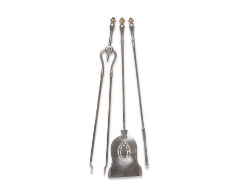 A SET OF THREE REGENCY POLISHED STEEL AND GILT FIRE TOOLS CIRCA 1820 the shovel 76cm long 