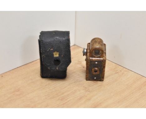 A Coronet Midget miniature camera in brown bakelite by Coronet Camera Company, Birmingham in original leather case