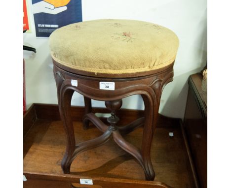 A TWENTIETH CENTURY CIRCULAR STOOL, with twist adjustable pad seat 