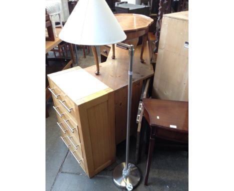 A MODERN STEEL STANDARD LAMP